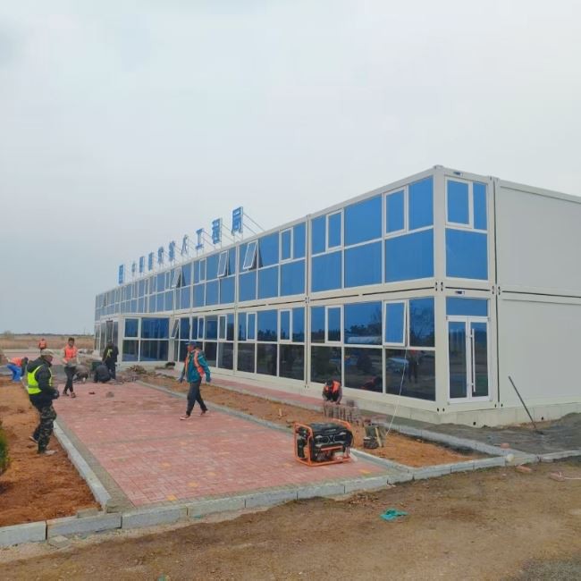 This is a two-story prefabricated container house with curtain wall molding for office space, side view